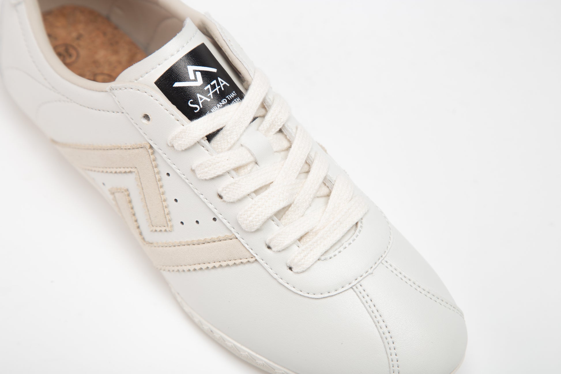 SA77A颯合 AMOY BLANC DE BLANC. The brand that spells H with double seven. Sa77a Sustainable sneaker. Pair of white sneakers.