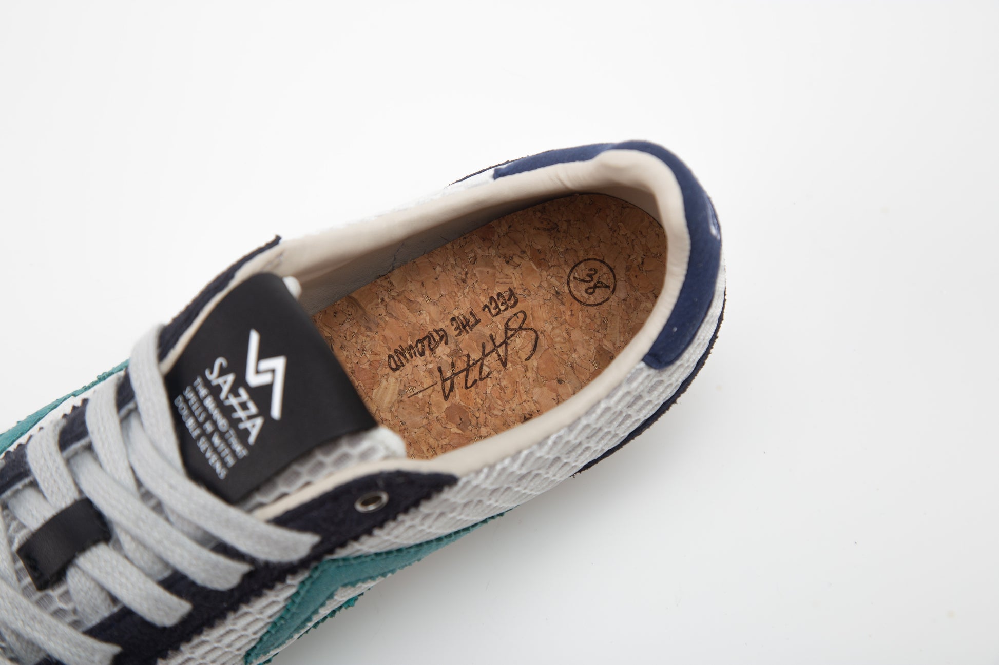 SA77A颯合 CATHAY HONG KONG BAY The brand that spells H with double seven. SA77A Sustainable sneaker one pair of blue and white sneakers on a white background. SA77A Feel the Ground Cork Insoles