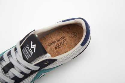 SA77A颯合 CATHAY HONG KONG BAY The brand that spells H with double seven. SA77A Sustainable sneaker one pair of blue and white sneakers on a white background. SA77A Feel the Ground Cork Insoles