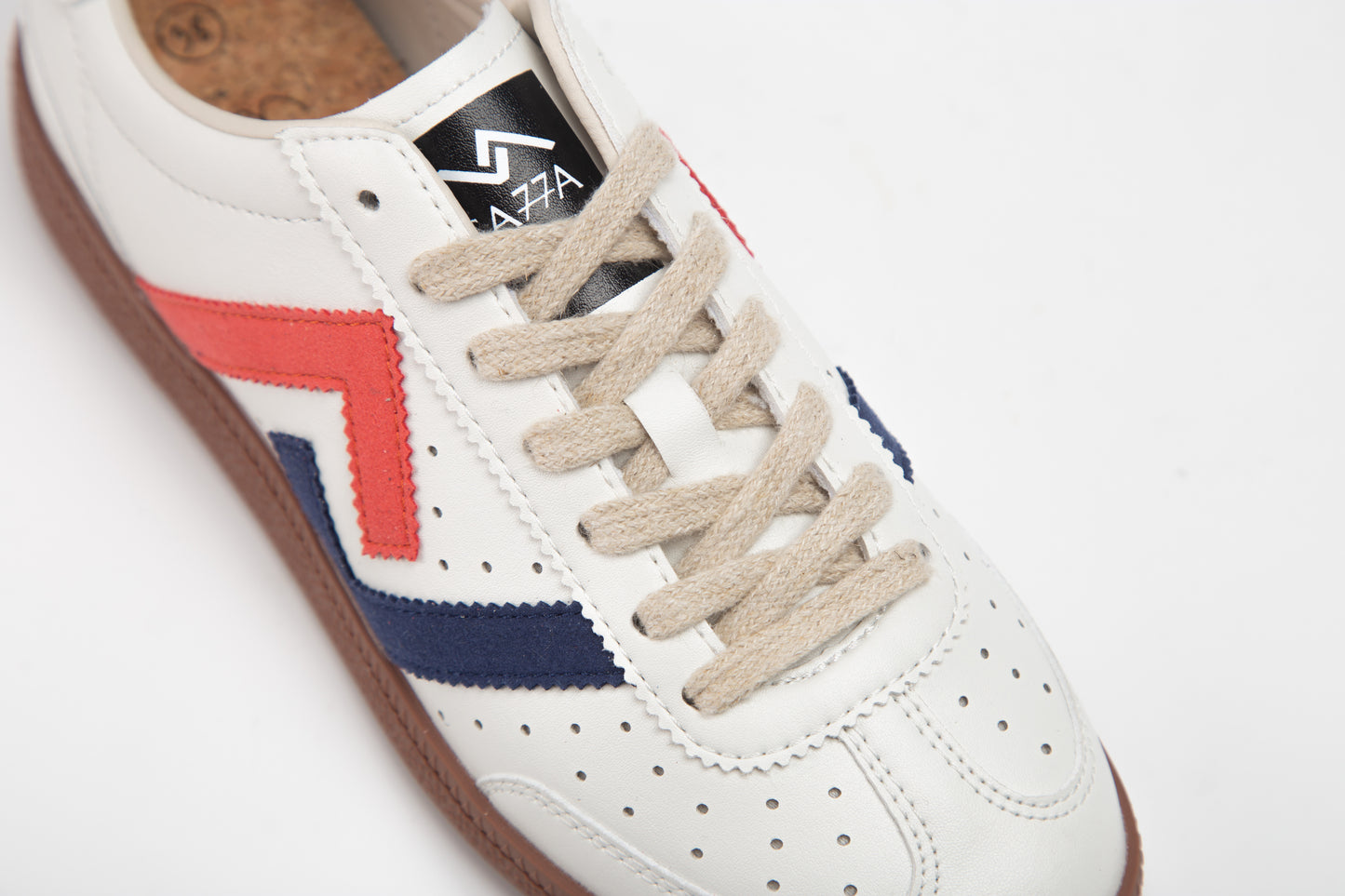 SA77A 颯合White sneaker with red and blue accents on a white background