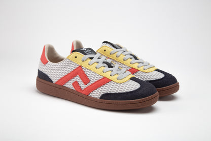SA77A 颯合STEPS NIGHT CAB. Sa77a Sustainable sneaker. Yellow, Red and Dark Blue sneakers with a double seven logo on a white background.